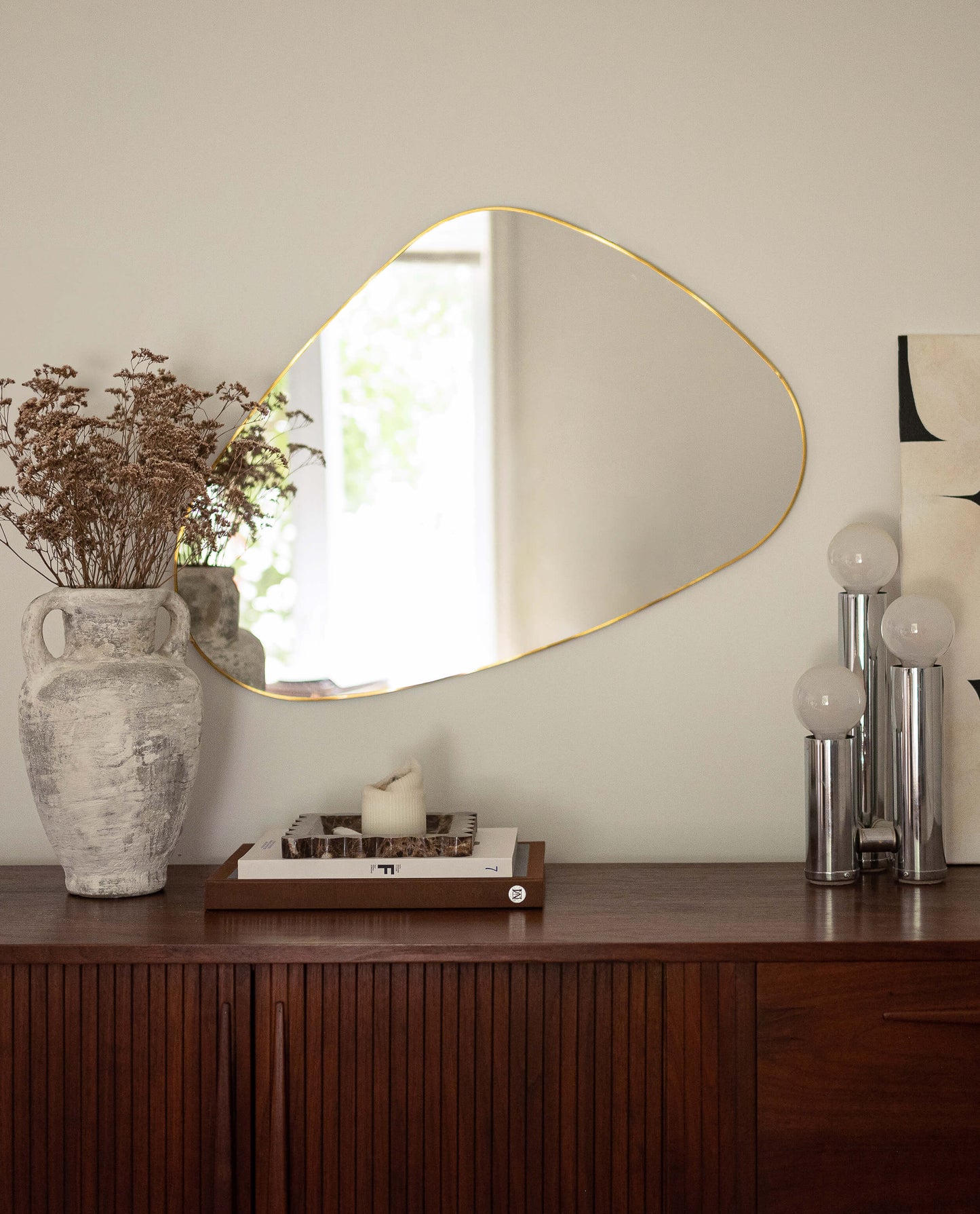 Miroir irrégulier doré